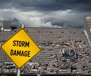 storm damage sign with damage roof