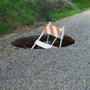 SINKHOLE ON HOME PROPERTY