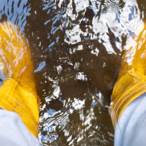 standing in a flooded basement with yellow rubber boots